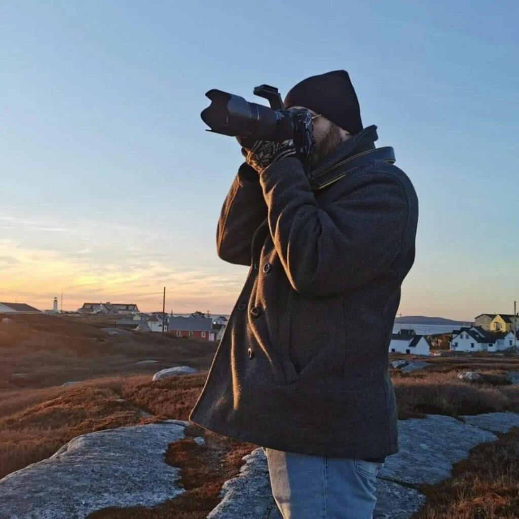 Jay Fisher holding a camera